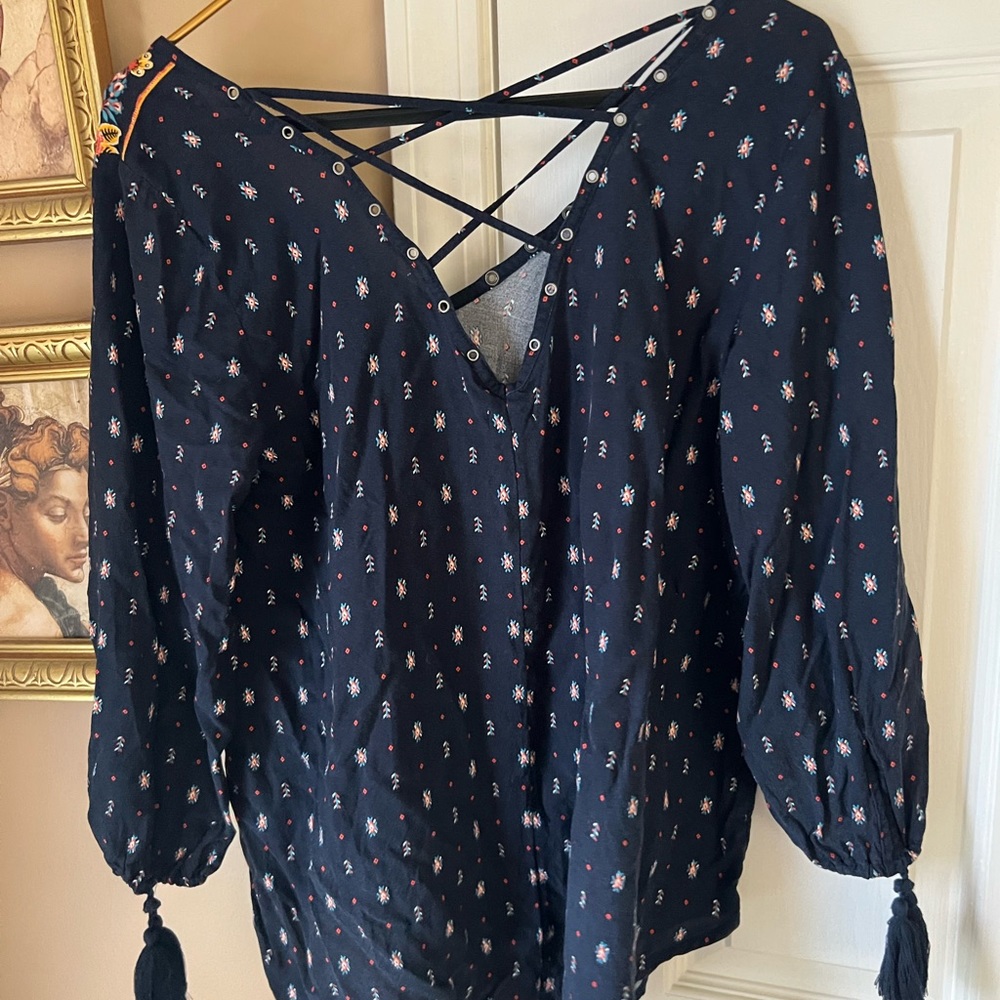 Gorgeous navy peasant blouse with criss-cross back and tasseled sleeves!